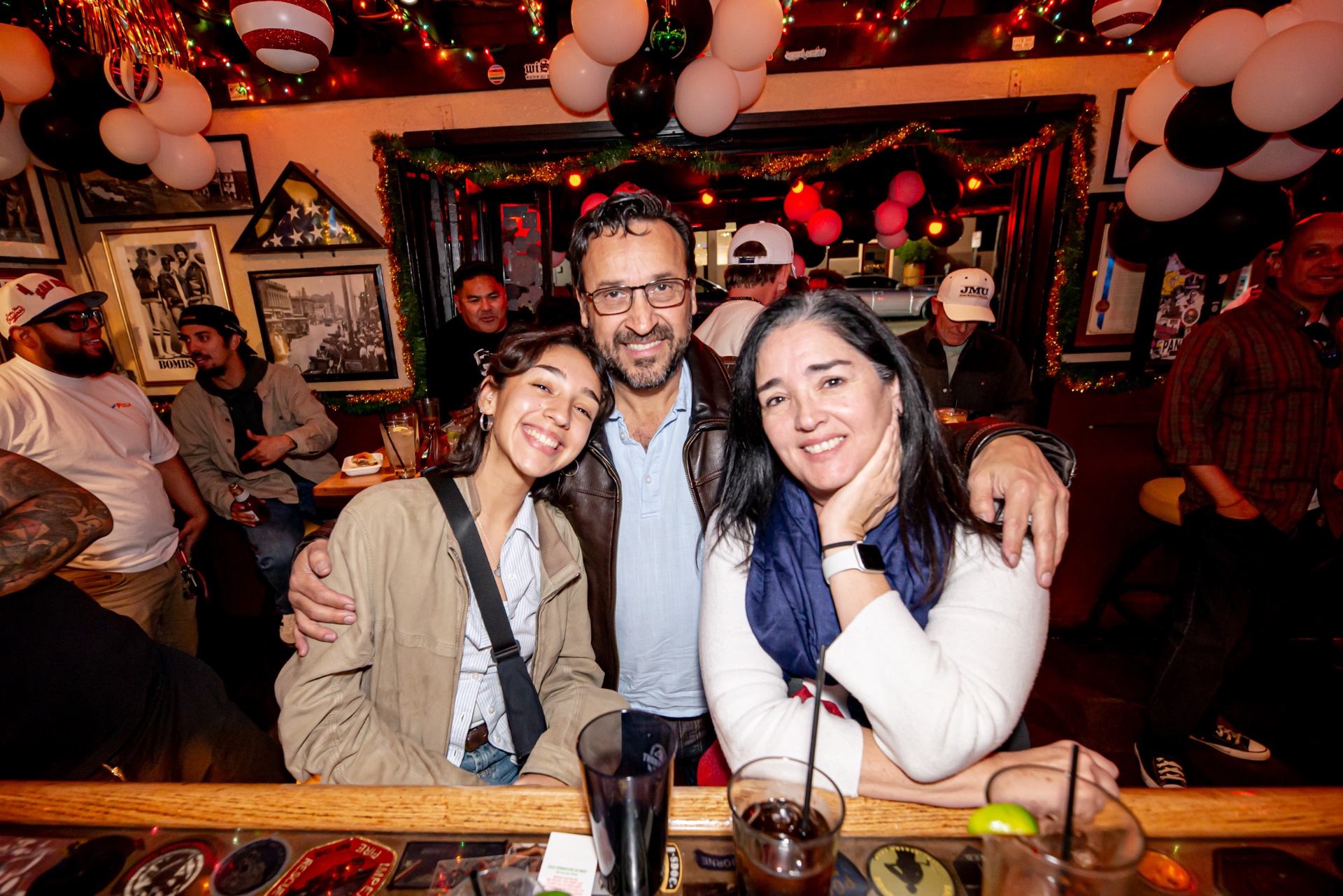 A family gathered around a table at Waterfront Bar & Grill in Little Italy