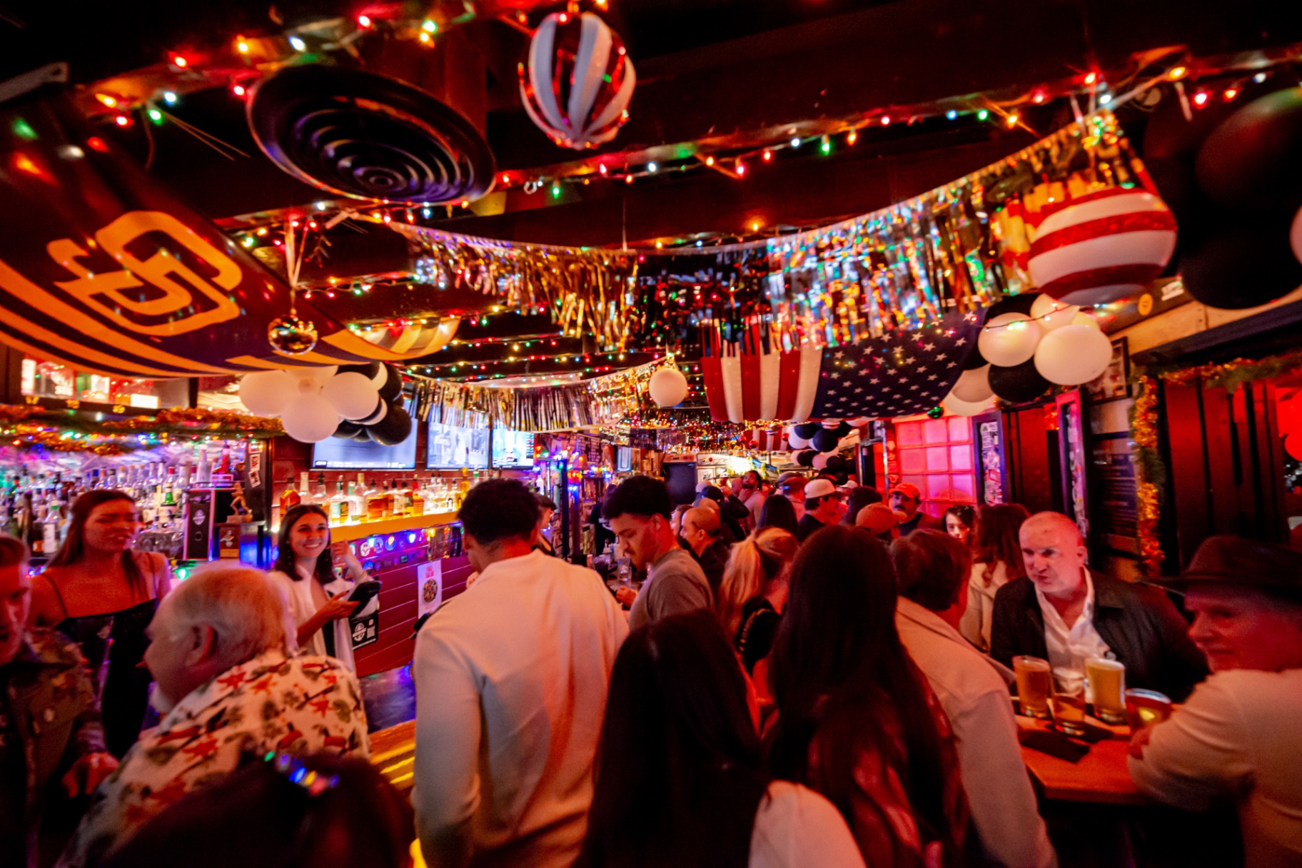 A packed night inside Waterfront Bar & Grill in Little Italy, San Diego
