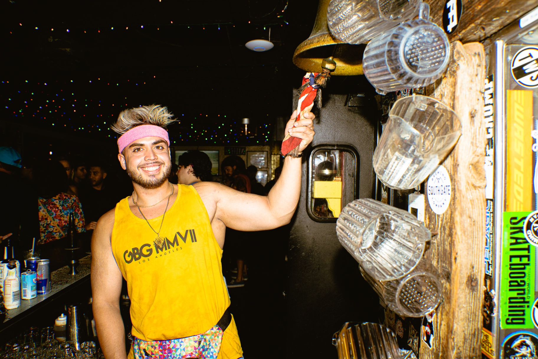 Bartender ringing the tip bell at Waterfront Bar & Grill