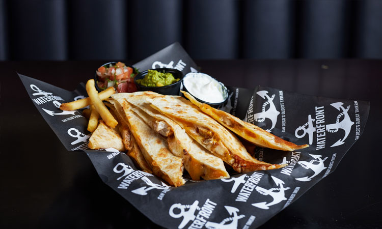 Waterfront quesadilla with pico, guacamole, sour cream, and fries